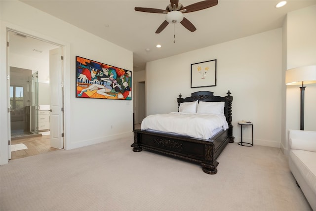 bedroom with connected bathroom, ceiling fan, and carpet floors