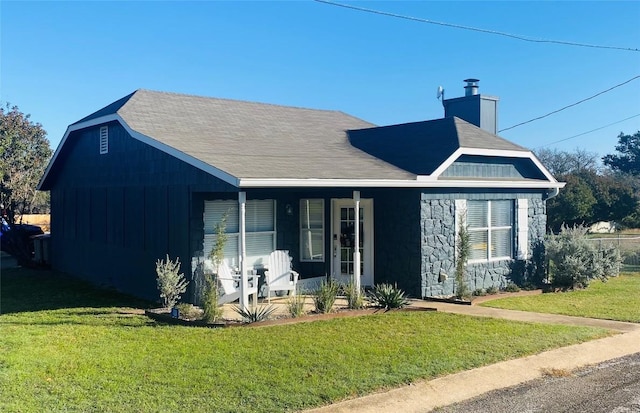 view of front of property with a porch and a front yard