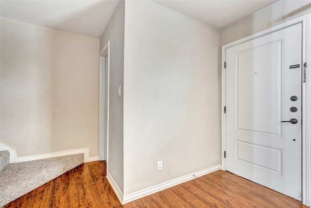 entryway with hardwood / wood-style floors