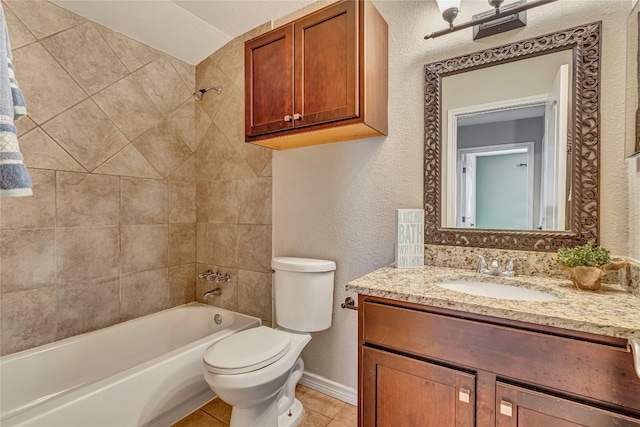 full bathroom with tile patterned floors, vanity, toilet, and tiled shower / bath