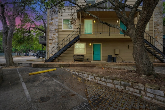 view of back house at dusk