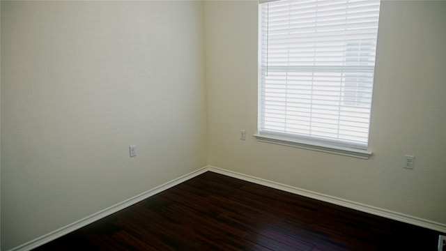 empty room featuring dark hardwood / wood-style floors