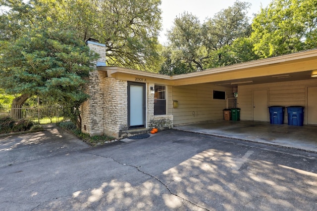 exterior space with a carport