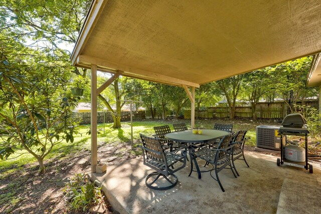 view of patio / terrace with central AC and a grill