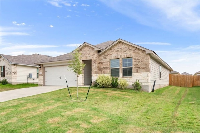 view of front of house with a garage and a front lawn