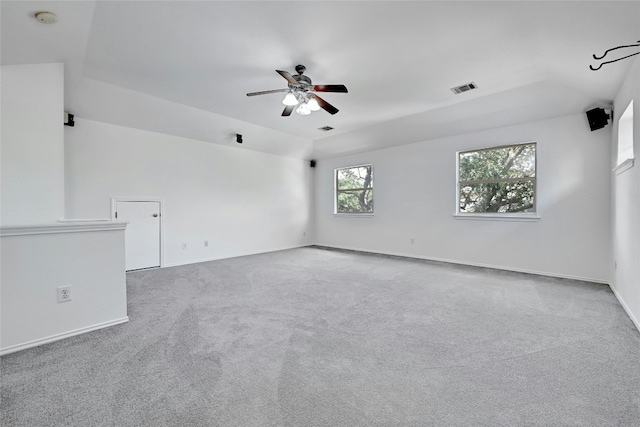 carpeted spare room featuring ceiling fan