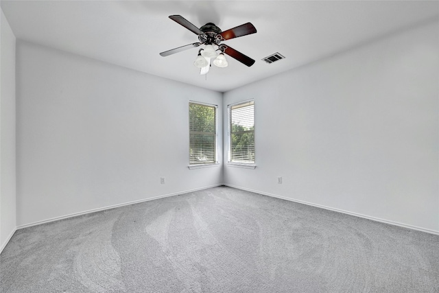 unfurnished room with carpet flooring and ceiling fan