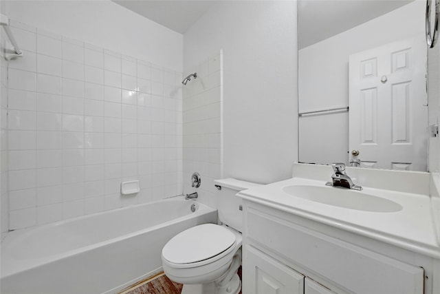 full bathroom with hardwood / wood-style flooring, oversized vanity, toilet, and tiled shower / bath combo