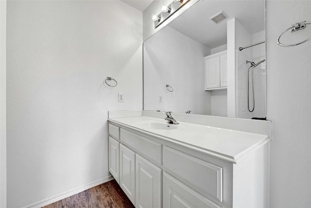 bathroom featuring wood-type flooring and vanity