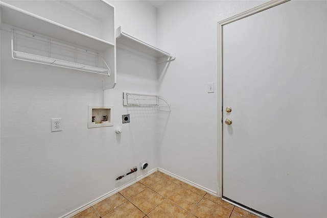 washroom with hookup for an electric dryer, hookup for a washing machine, light tile floors, and hookup for a gas dryer