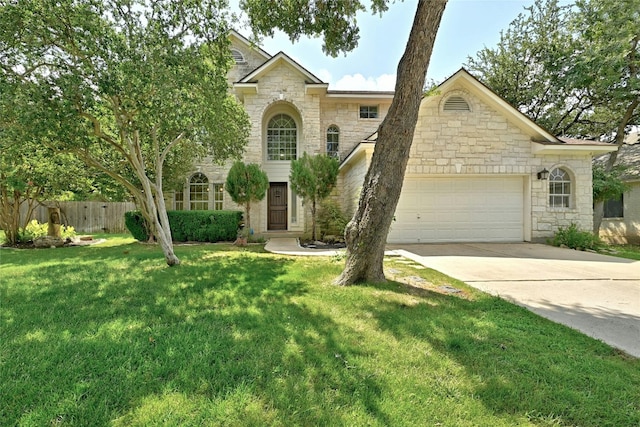 view of front of property with a garage and a front lawn