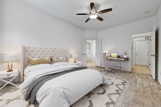 bedroom with ceiling fan and light hardwood / wood-style floors