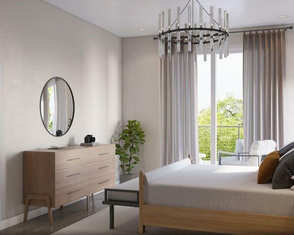 bedroom featuring dark hardwood / wood-style floors and an inviting chandelier