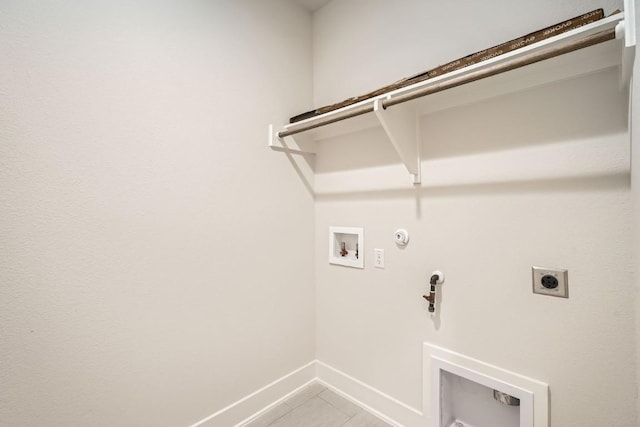 laundry area with tile patterned floors, washer hookup, hookup for an electric dryer, and hookup for a gas dryer