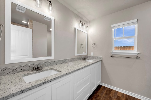 bathroom featuring hardwood / wood-style flooring and vanity