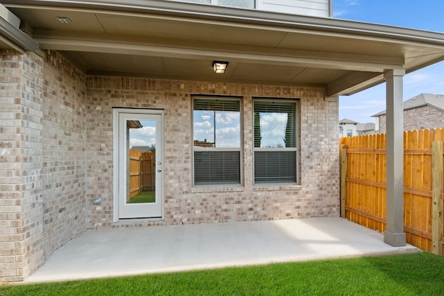 entrance to property with a patio area