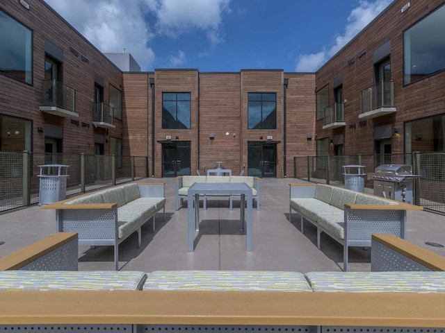 view of patio with an outdoor hangout area and a grill