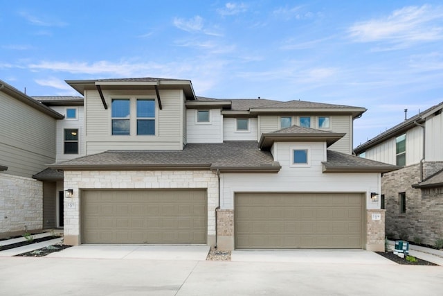 prairie-style house featuring a garage