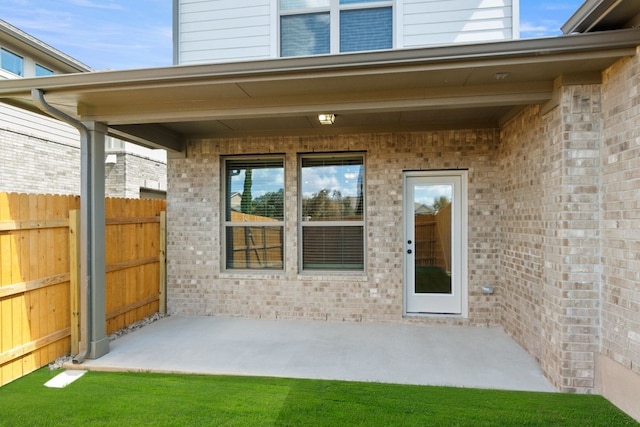 property entrance featuring a patio area