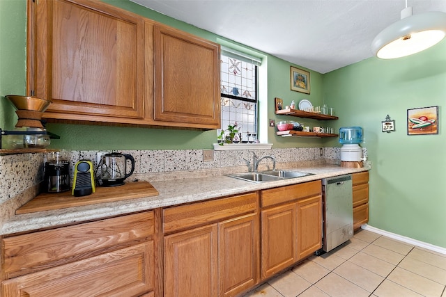 kitchen with dishwasher, sink, and light tile patterned flooring