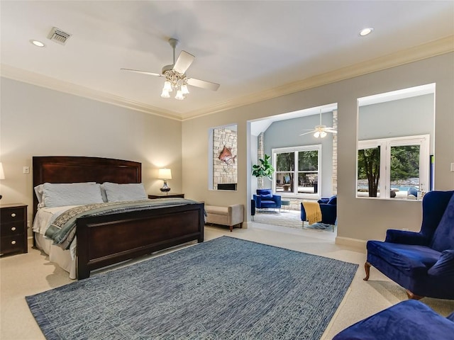 bedroom featuring ceiling fan, light colored carpet, and ornamental molding