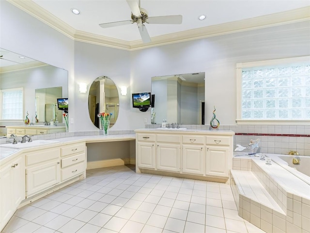 bathroom featuring vanity, ceiling fan, crown molding, tiled tub, and tile patterned flooring