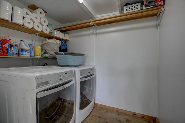 clothes washing area featuring independent washer and dryer