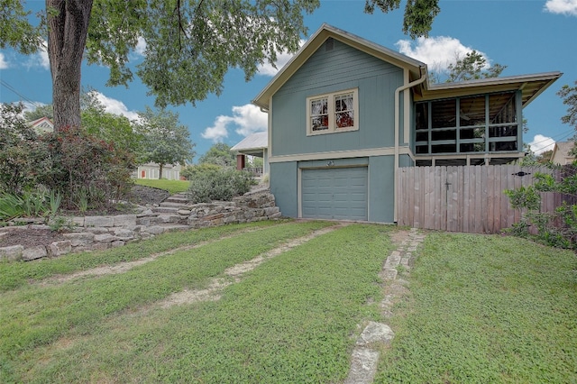 exterior space with a yard and a garage