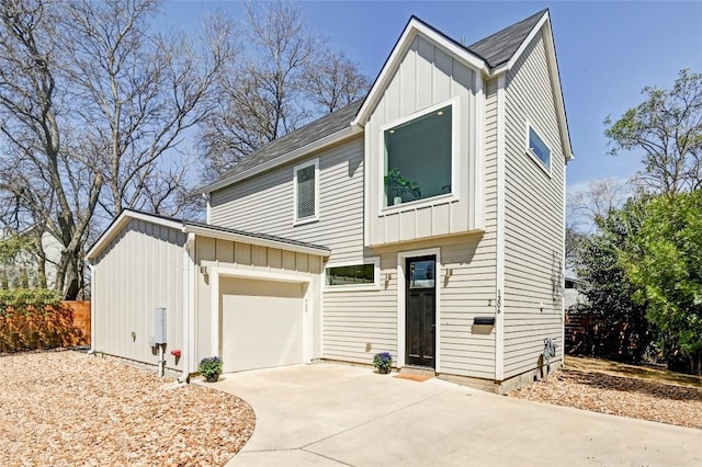 view of front facade featuring a garage, driveway, and board and batten siding