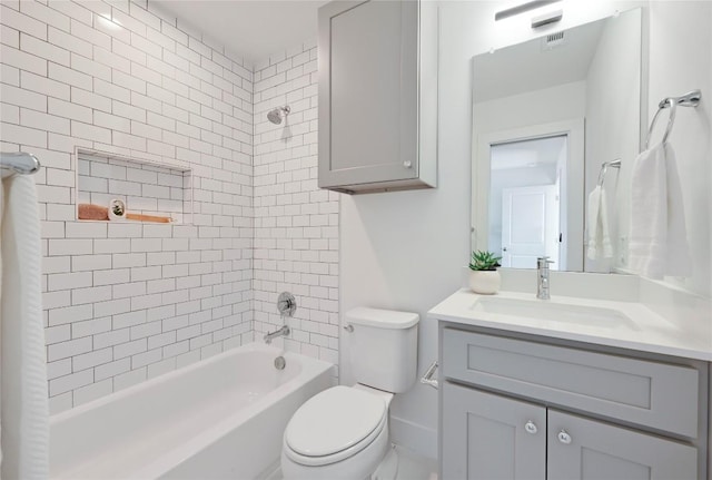 full bath with  shower combination, visible vents, vanity, and toilet