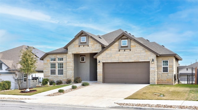 view of front of house with a front yard and a garage