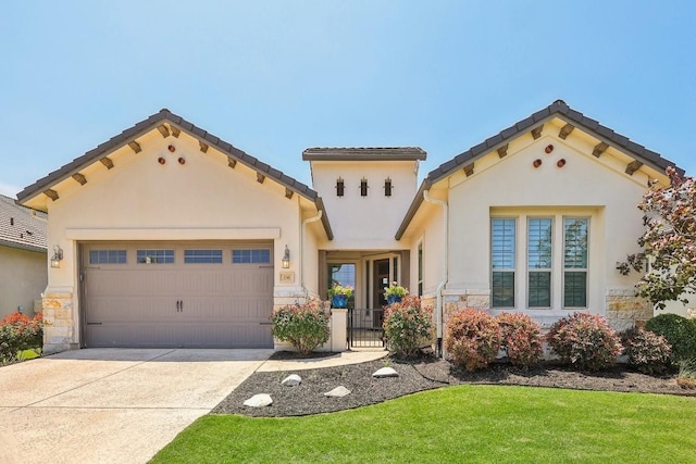 mediterranean / spanish-style house with a garage and a front lawn