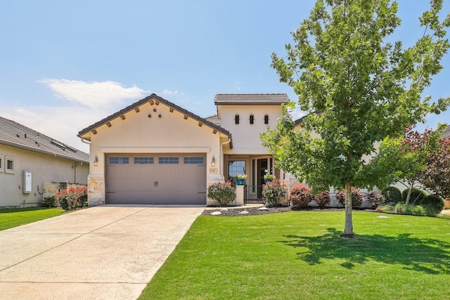 mediterranean / spanish-style house featuring a garage and a front yard