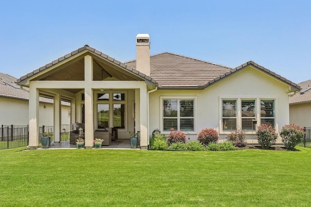 rear view of house with a lawn