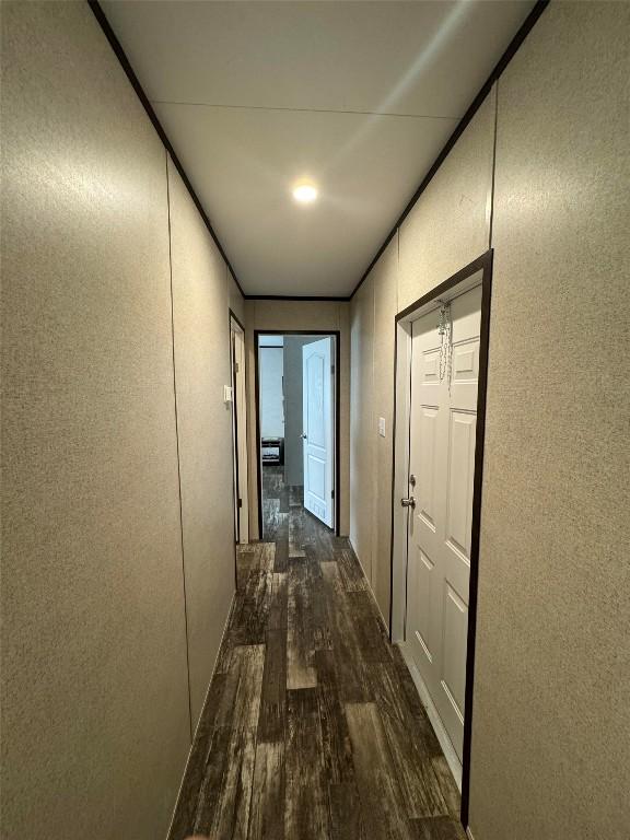 hall with dark hardwood / wood-style flooring