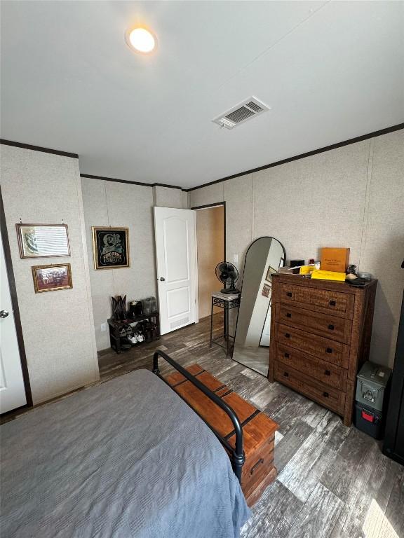 bedroom featuring dark wood-type flooring