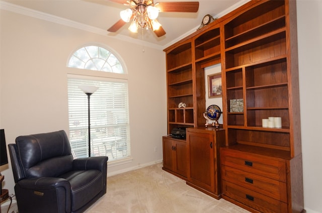 sitting room featuring crown molding, light colored carpet, and ceiling fan