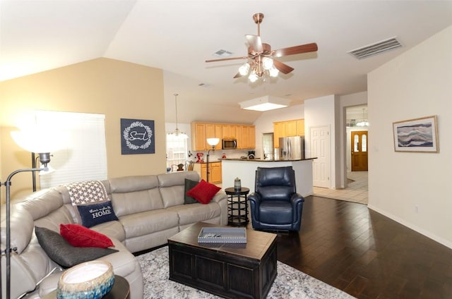 living room featuring lofted ceiling, dark hardwood / wood-style flooring, and ceiling fan