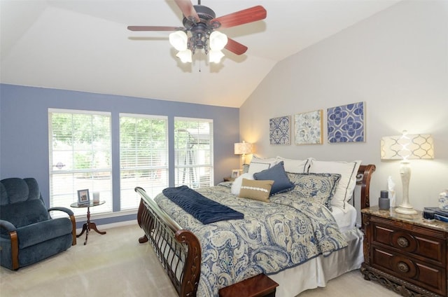 carpeted bedroom with vaulted ceiling and ceiling fan