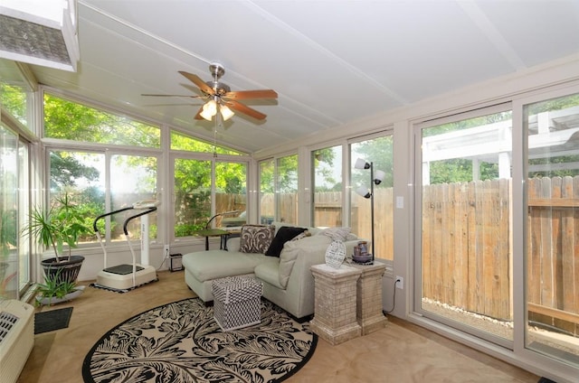 sunroom with lofted ceiling and ceiling fan