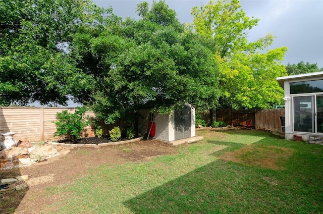 view of yard with a storage unit