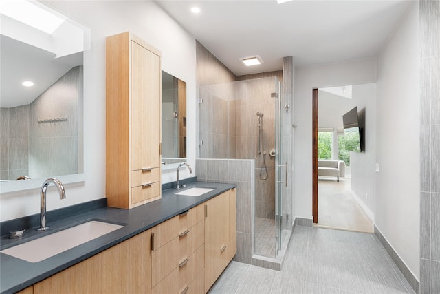 bathroom featuring tile patterned flooring, vanity, vaulted ceiling, and an enclosed shower