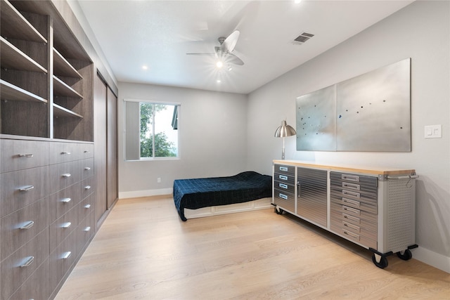 bedroom featuring light hardwood / wood-style flooring and ceiling fan