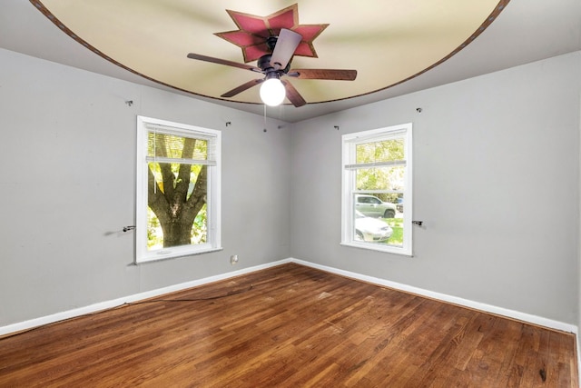 spare room with wood-type flooring and ceiling fan