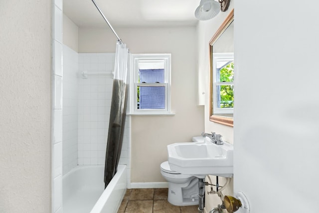 full bathroom featuring shower / tub combo, sink, tile patterned floors, and toilet