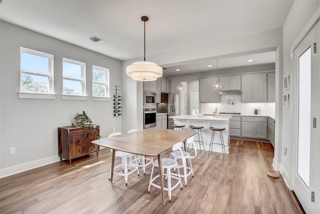 dining area featuring light hardwood / wood-style floors