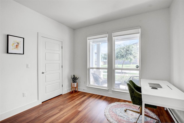 home office with hardwood / wood-style floors