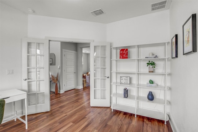 interior space featuring french doors and dark hardwood / wood-style flooring