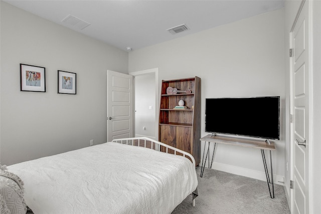 bedroom featuring light carpet