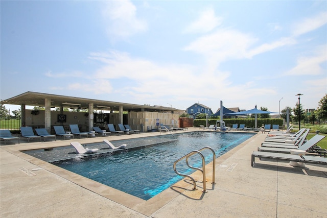 view of swimming pool with a patio